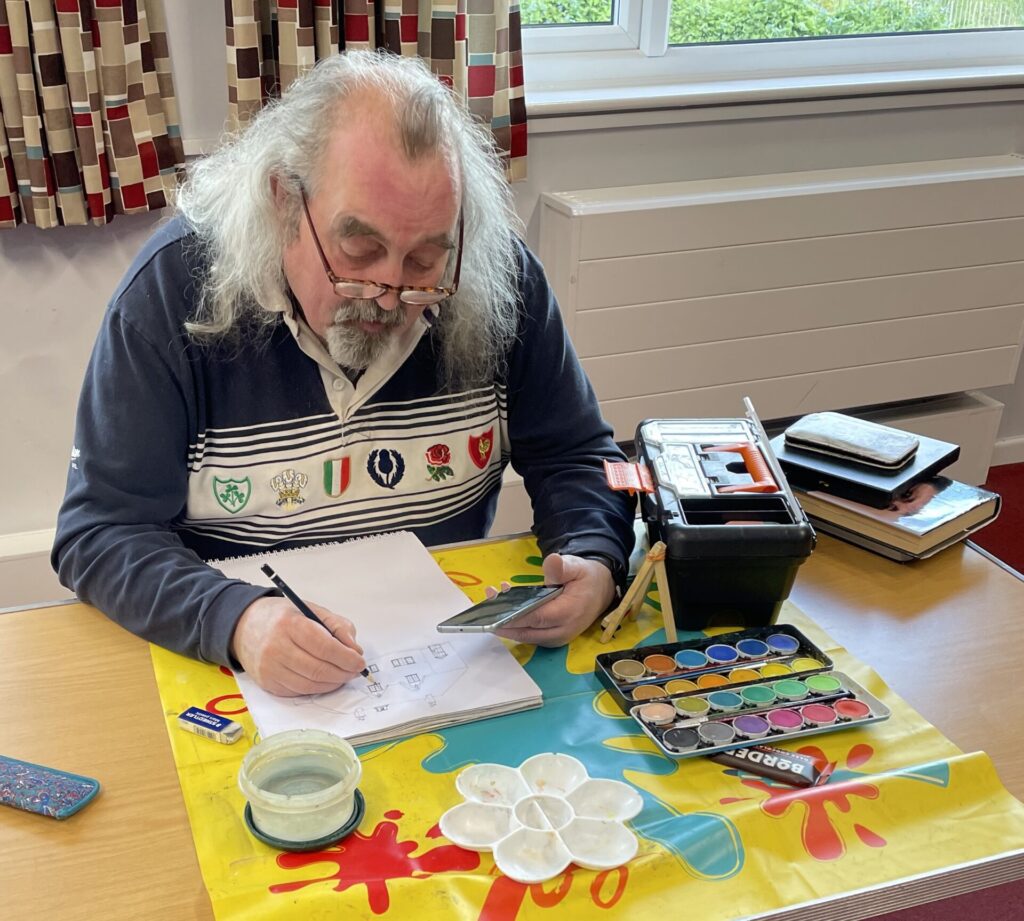 Man engrossed in sketching